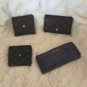 Bundle of Louis Vuitton wallets and 1 Miu Miu -all included